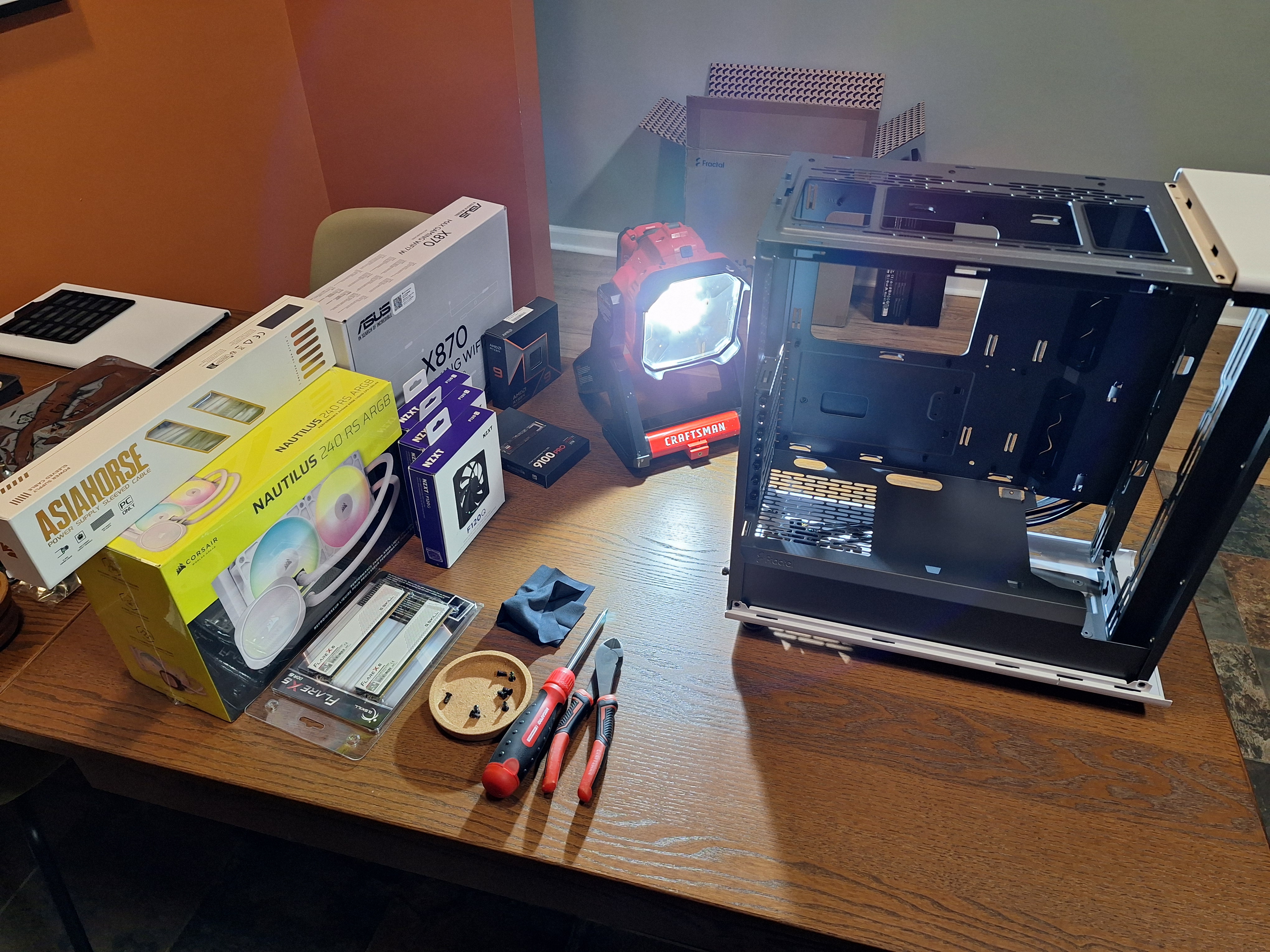 Fractal North case, components, and tools laid out before assembly